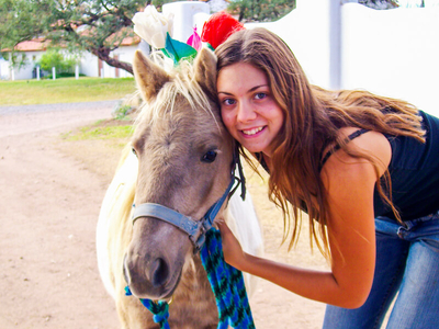 Young girl with a small horse.